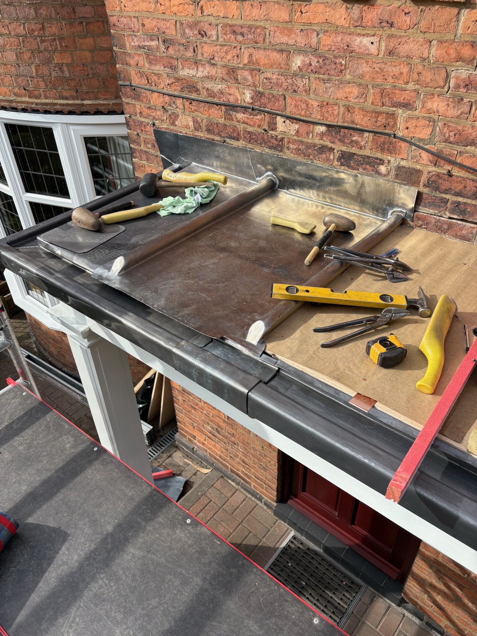 Lead upstand on a door canopy prepared ready for a cover flashing detail