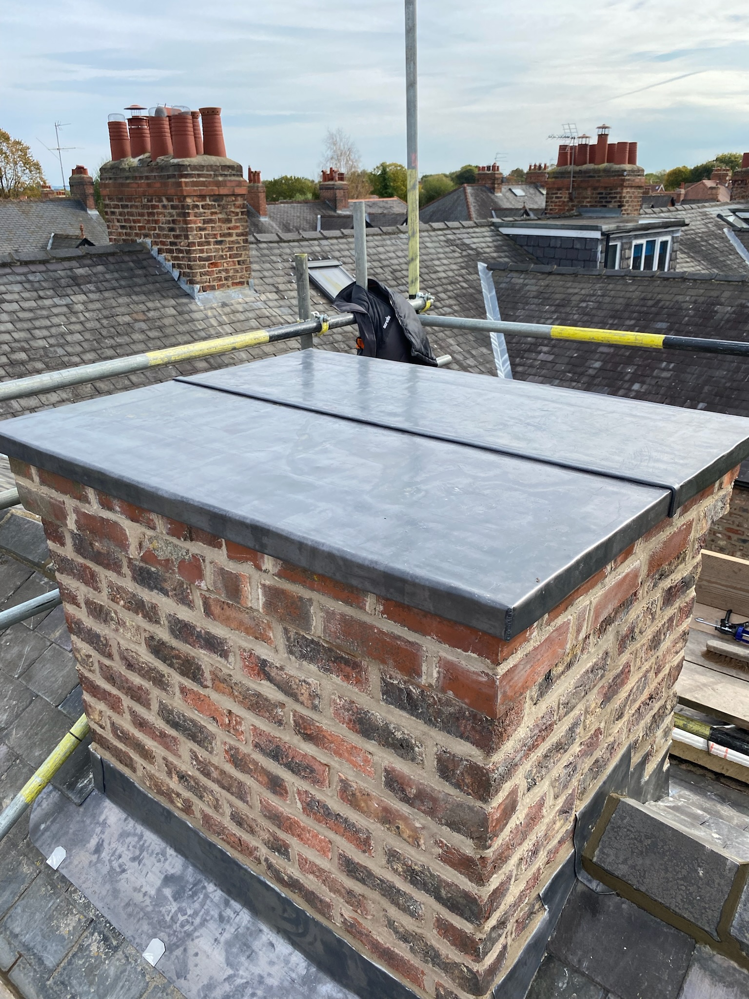Chimney lead flashing with vented cap to a truncated chimney